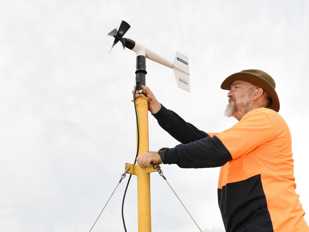 David Henderson, Chief Engineer of the JCU Cyclone Testing, setting up an anemometer in Townsville. Picture: Shae Beplate.