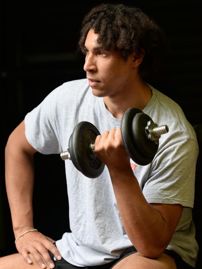 Aiden completes a workout at his home in Cranbourne West. Picture: Lawrence Pinder