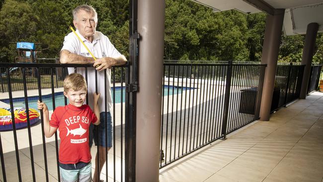 Former Olympic swimming coach Laurie Lawrence with Tom, 4. Picture: Nigel Hallett