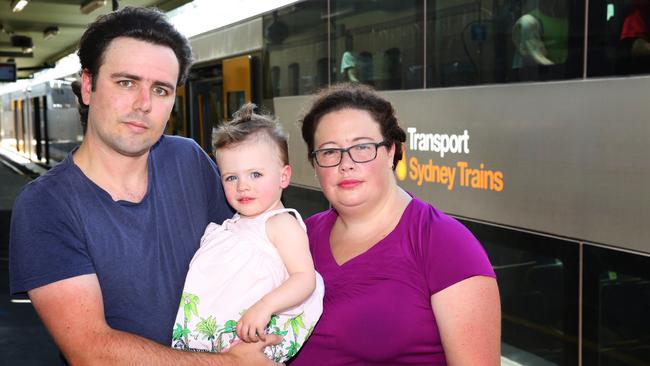 Matthew Hatton and Erin Rely with their daughter Abigail Hatton. The couple has noticed more delays and cancellations since the new timetable was introduced. Picture: Angelo Velardo