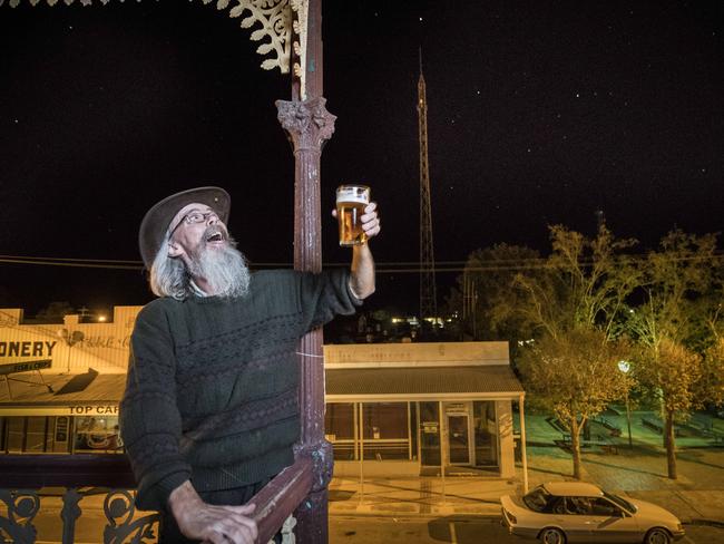 Publican Dave Walter cheers the night sky for bring his pub bus loads of tourists. Picture: Jason Edwards