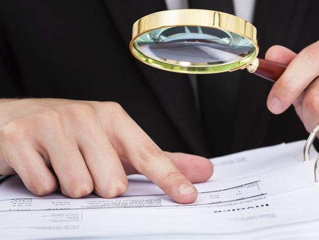 Businessman Analyzing Document, Audit, Magnifying Glass, Document, Corporate Theft, Examining, Contract, Exploration, Paper, Looking, Detective, Paperwork, Business, Advice, Businessman, One Person, People, Financial Advisor, Expertise, Finance, Glass - Material, Agreement, Currency, Office, Research, Corporate Business, Form, Men, Adult, Adults Only, Beautiful People, Brown Hair, Chair, Close-Up, Concepts, Concepts & Topics, Desk, Handsome, Holding, Horizontal, Human Body Part, Human Finger, Human Hair, Human Hand, Indoors, Letter, Letter, List, Males, Occupation, Office Chair, One Man Only, Only Men, Photography, Place of Work, Reflection, Sitting, Zoom, thinkstock, generic, istock