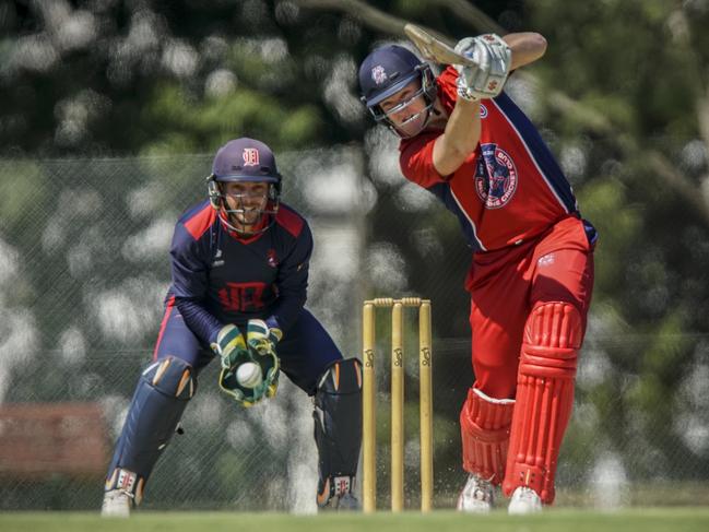 Vic Premier Cricket: Dandenong v Melbourne. Dandenong keeper Jacques Augustin and Melbourne batsman Cameron White. Picture: Valeriu Campan