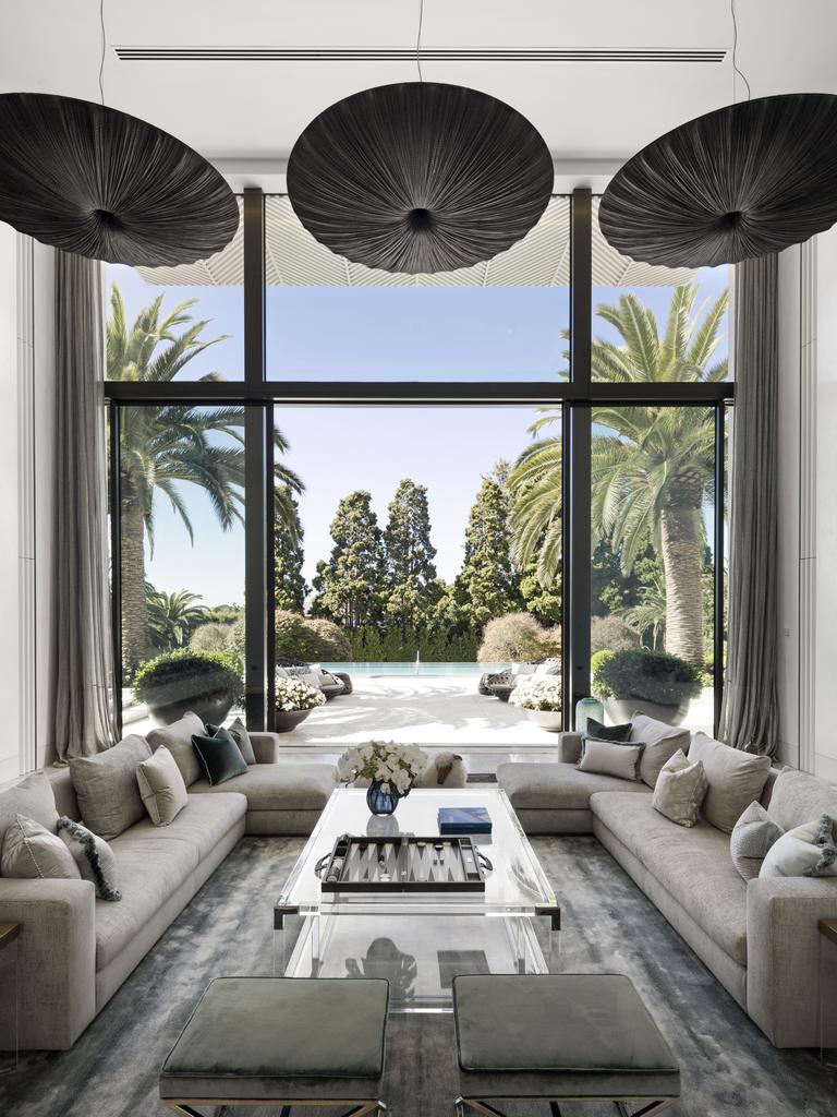 Inside the home’s lounge room, which looks out on the pool.