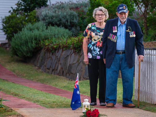 Brian and Jenny O'Leary in their driveway for the Light up the Dawn Anzac Day 2020 service. Brian is ex-RAN. Picture: Kevin Farmer