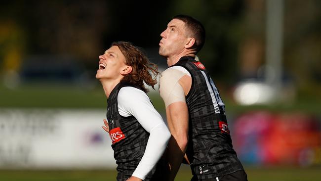 Darcy Cameron, right, and Aiden Begg battle it out at Collingwood training. Picture: Michael Willson/AFL Photos