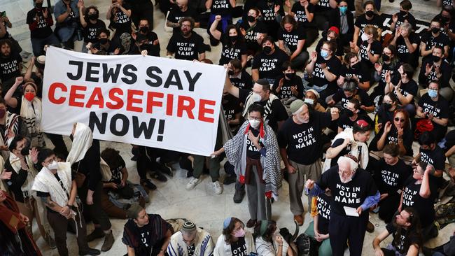 Protesters hold a demonstration in support of a ceasefire in Gaza in the Cannon House Office Building in Washington DC.