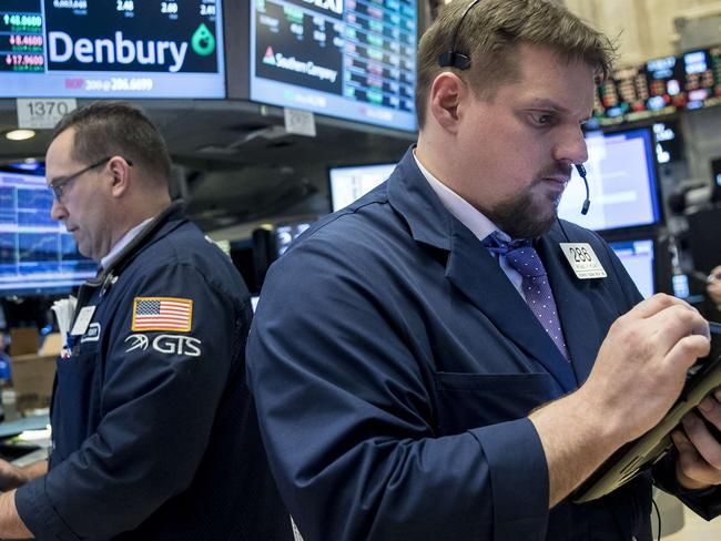 NEW YORK, NY - MARCH 31: Traders work and financial professionals work on the floor of the New York Stock Exchange (NYSE) ahead of the closing bell, March 31, 2017 in New York City. The Dow Jones industrial index notched its sixth-straight positive quarter, marking the best run for the Dow since 2006. (Drew Angerer/Getty Images) == FOR NEWSPAPERS, INTERNET, TELCOS & TELEVISION USE ONLY ==