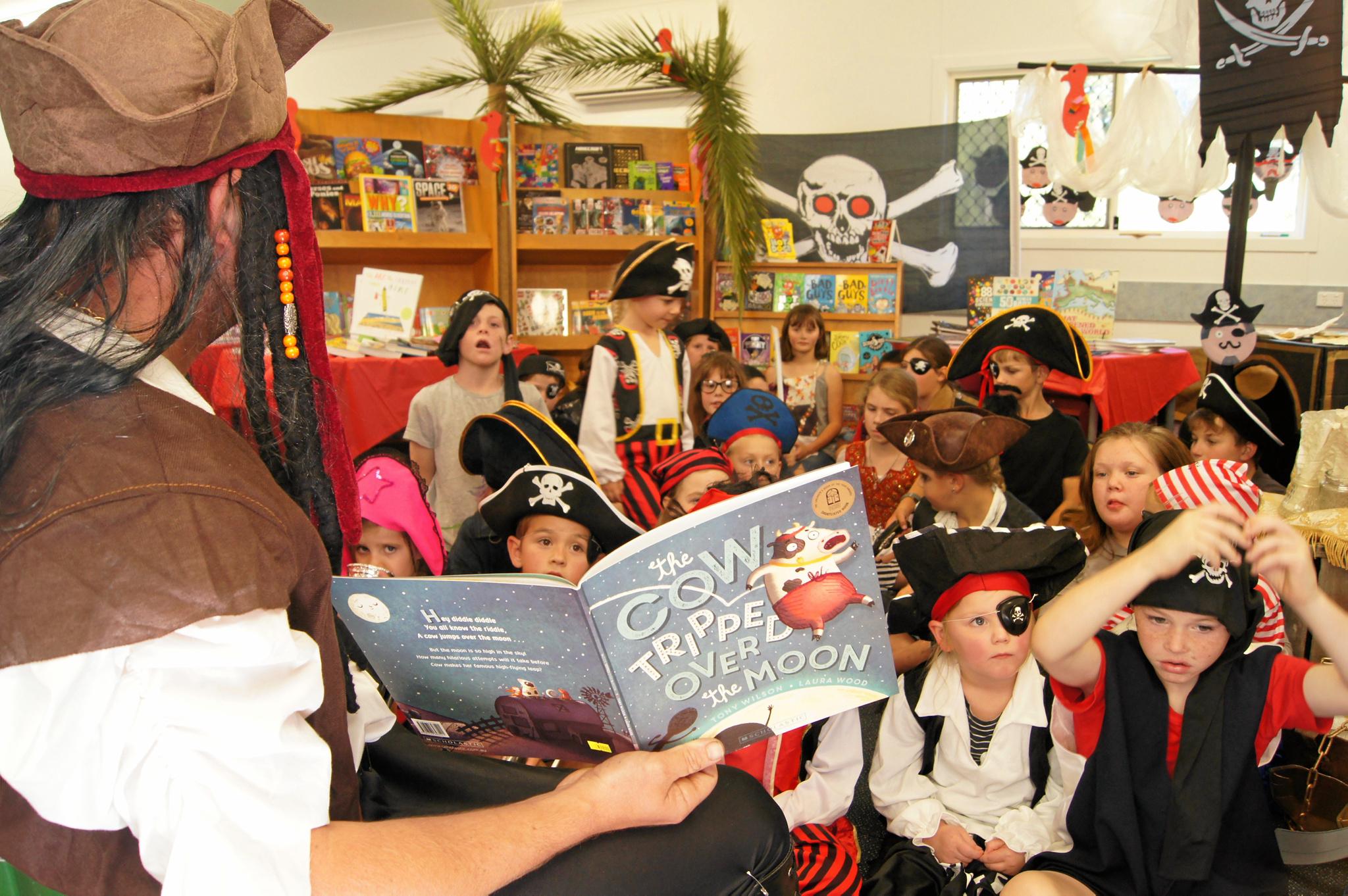 Students, teachers and parents dress up as pirates for a reading day at