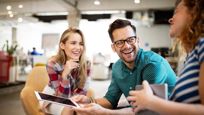 Business people, designers having fun and chatting at workplace office