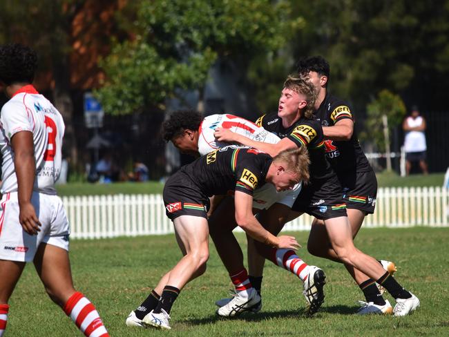 Cyrus Stanley-Traill is tackled by Cooper Hale in the Harold Matthews Cup. Picture: Sean Teuma/NewsLocal