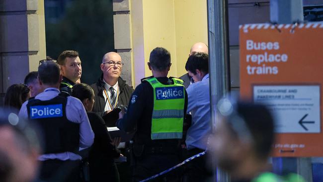 Police outside Flinders Street Station after a man was shot by a PSO. Picture: Ian Currie