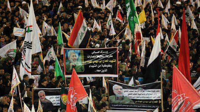 The funeral procession of Abu Mahdi al-Mohandes winds through the central Iraqi city of Karbala on Saturday. Picture: AFP