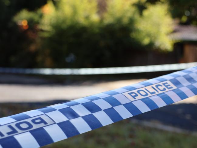 Police tape at the scene of a fatal house fire on Giltinan Place, in the ACT suburb of Holt. on May 22, 2024. Picture: Blake Foden