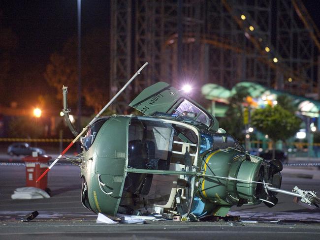 A chartered helicopter which crash-landed on to a car park at the Gold Coast's Dreamworld. Picture: AAP Image/Dave Hunt