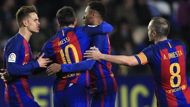FC Barcelona's Lionel Messi, center, celebrates after scoring with teammates Denis Suarez, left, Neymar.