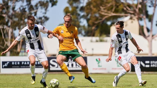 Adelaide City’s Anthony Ture and Cumberland’s Karl Phelps at Adelaide City Park in 2020. Picture: AAP Image/Matt Loxton