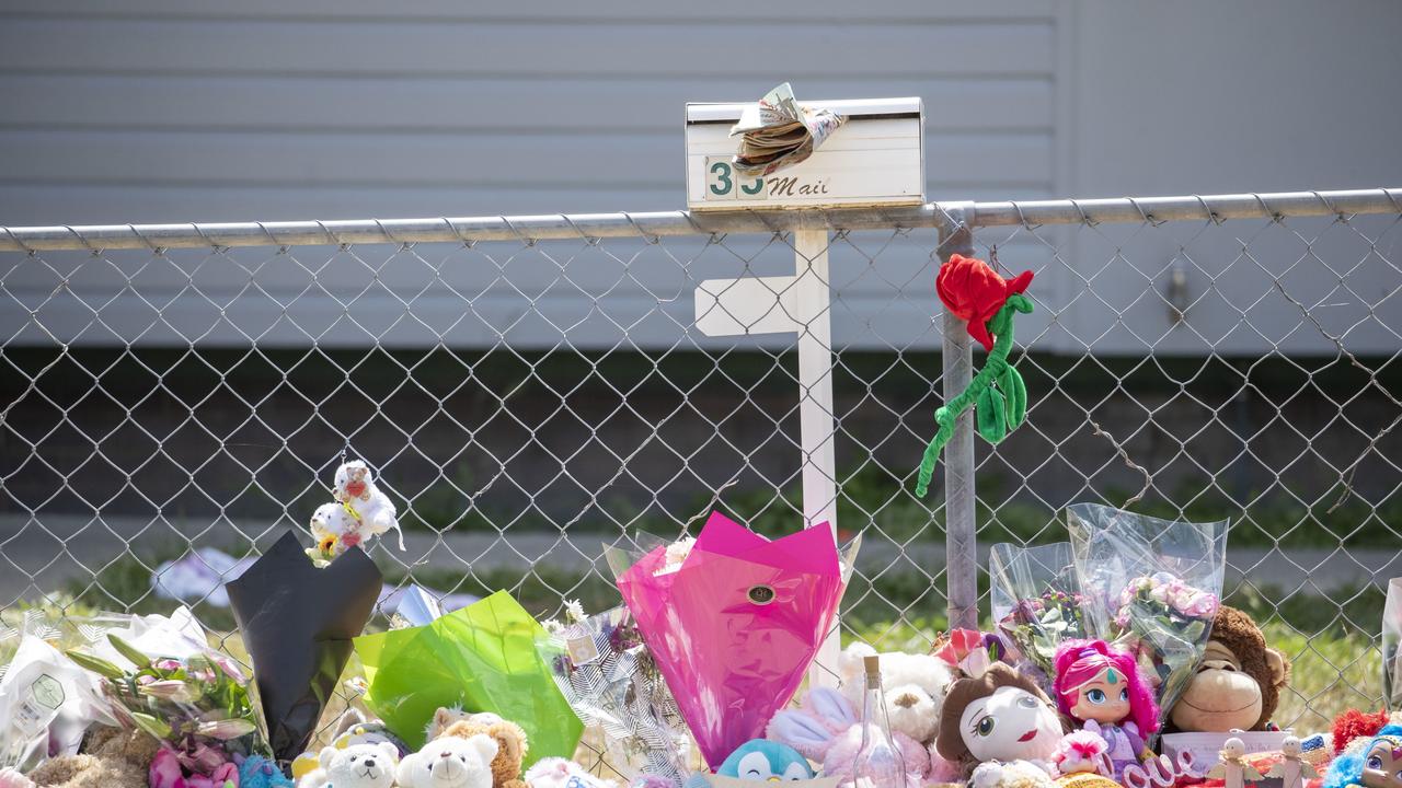 Tributes at a house on Logan Reserve Road, Waterford West, where two girls died after being left in a hot car for more than nine hours in sweltering heat in 2019. (AAP Image/Glenn Hunt)