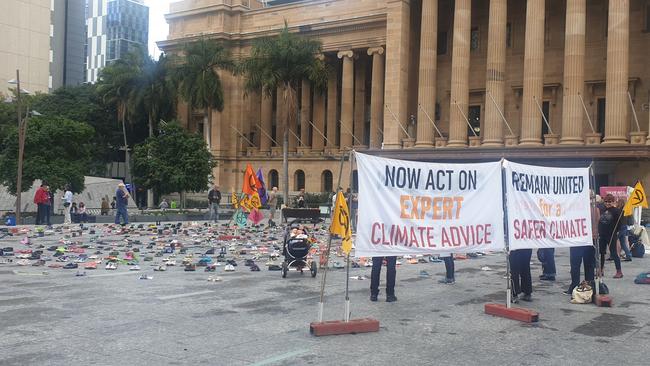 Hundreds of shoes arranged in a circle at King George Square in Brisbane's CBD.