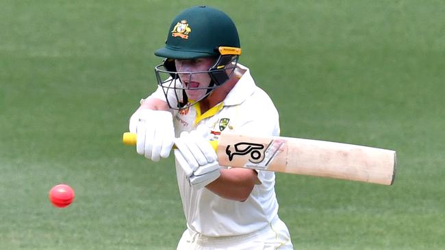 Marcus Harris goes after a ball outside off stump during his last Test innings at the Gabba.