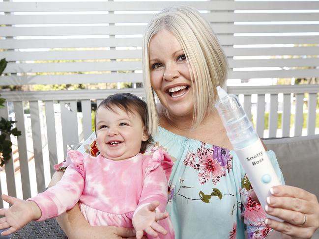 Aaliyah Hannaoui, 1, and Laura Klein posing at their home in Brisbane 8th of July 2020.  Laura developed the Snotty Boss which removes snot through battery powered suction for young children.  (Image/Josh Woning)