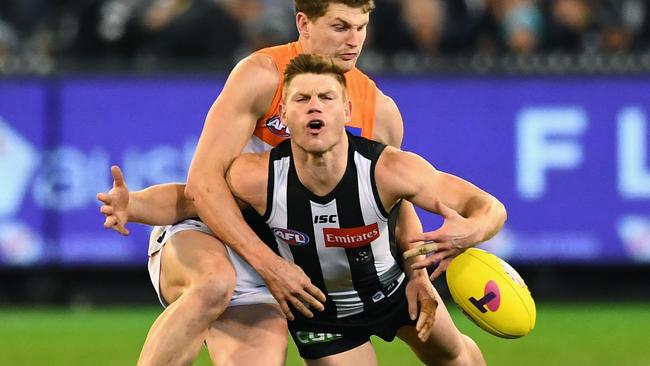 Taylor Adams is tackled by Jacob Hopper in last week’s semi-final. Picture: Getty Images