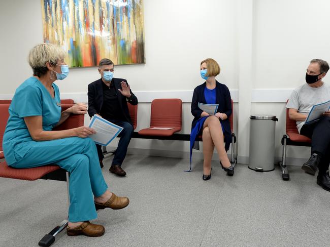 Dr Vanessa Haller sits with Chief Medical Officer Dr Brendan Murphy, former PM Julia Gillard and Health Minister Greg Hunt after they received their vaccines. Picture: Andrew Henshaw