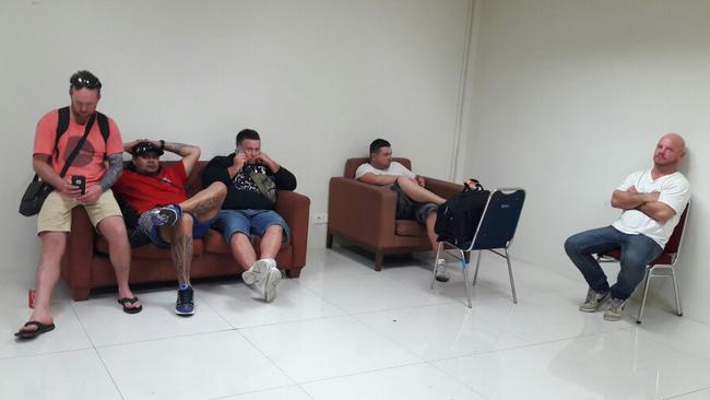 Five of the men taken off a Jetstar flight pictured today in detention holding area in Denpasar airport in Bali. Picture: Supplied