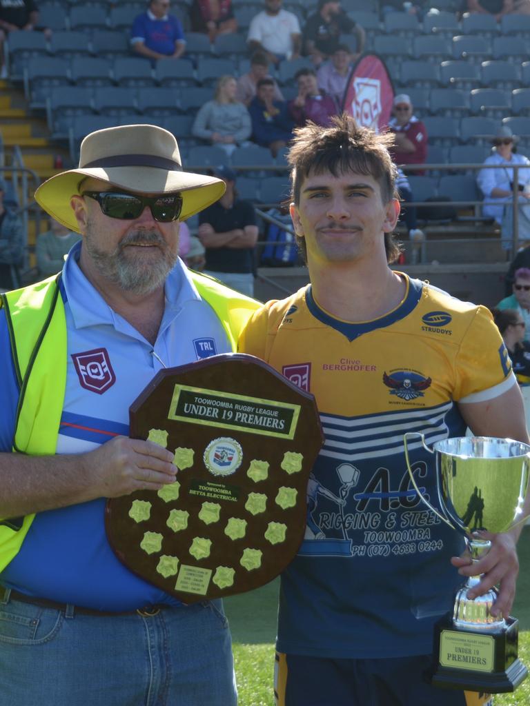 Highfields Eagles Under 19 captain Declan Ryan receives the trophy on TRL grand final day.