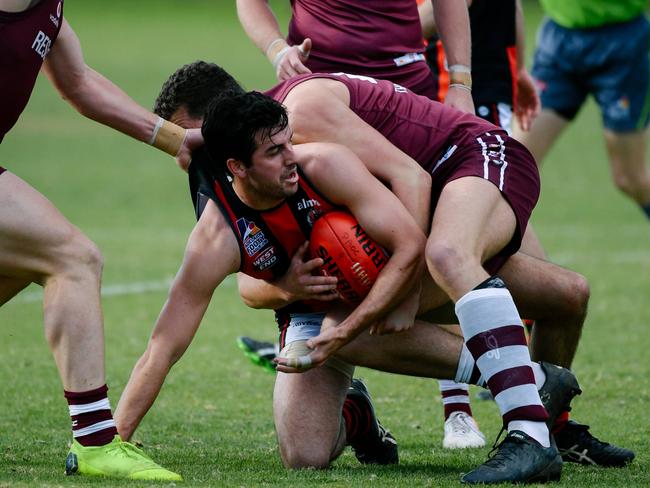 Kieran Holland with the ball on the ground during the Adelaide Footy League match between Prince Alfred Old Collegians and Rostrevor Old Collegians on Saturday, June 22, 2019. (AAP Image/ Morgan Sette)