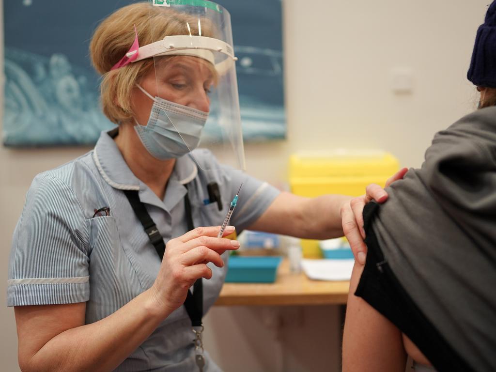 Key Worker Andrea Miles from North Shields receives the Pfizer BioNTech COVID-19 vaccine at a mass vaccination hub at the Centre For Life in Newcastle, England, on January 9. Picture: Ian Forsyth – Pool/Getty Images