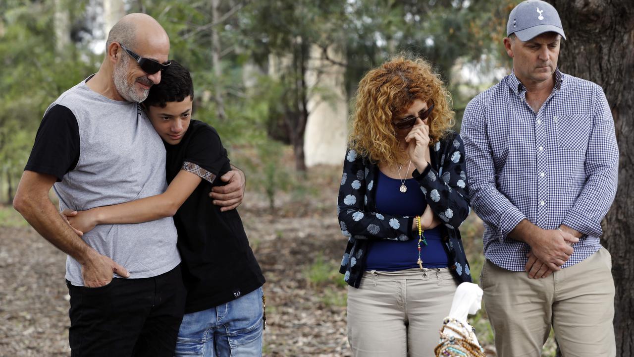 Bob Sakr (far left) with son Michael arrive at the memorial of the Oatland’s crash scene. Picture: Jane Dempster/The Australian.