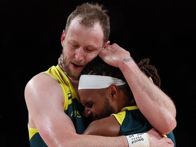 SAITAMA, JAPAN - AUGUST 07: Patty Mills #5 and Joe Ingles #7 of Team Australia hug after their win over Slovenia in the Men's Basketball Bronze medal game on day fifteen of the Tokyo 2020 Olympic Games at Saitama Super Arena on August 07, 2021 in Saitama, Japan. (Photo by Kevin C. Cox/Getty Images)