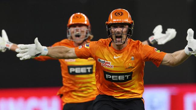 Perth Scorchers' Nick Hobson (R) and teammate Cooper Connolly celebrate after scoring the winning runs in the Big Bash League (BBL) Twenty20 cricket final between Perth Scorchers and Brisbane Heat at Optus Stadium in Perth on February 4, 2023. (Photo by TREVOR COLLENS / AFP) / -- IMAGE RESTRICTED TO EDITORIAL USE - STRICTLY NO COMMERCIAL USE --