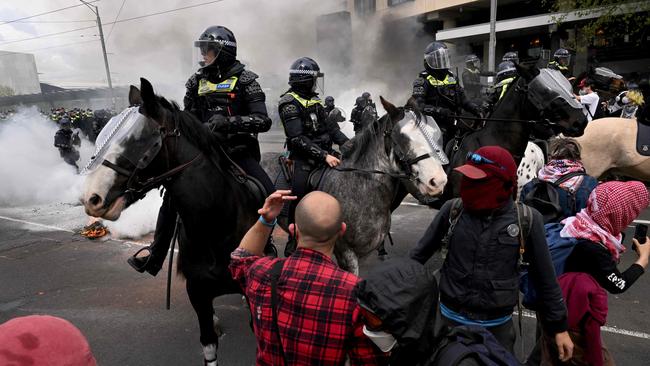 Protesters confront police outside the Land Forces 2024 arms fair in Melbourne. Picture: AFP