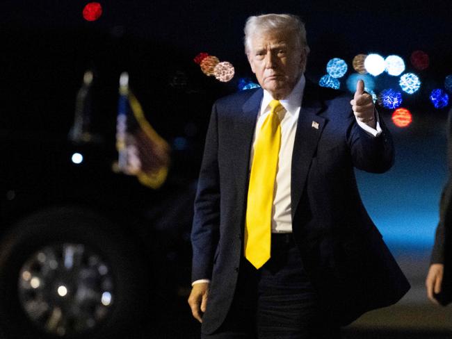 US President Donald Trump gives a thumb's up after stepping off Air Force One at Palm Beach International Airport in West Palm Beach, Florida, on March 7, 2025. Trump is spending the weekend at his Mar-a-Lago resort. (Photo by ROBERTO SCHMIDT / AFP)