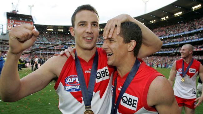 Tadhg Kennelly, Leo Barry and Barry Hall soak up Sydney’s premiership triumph.