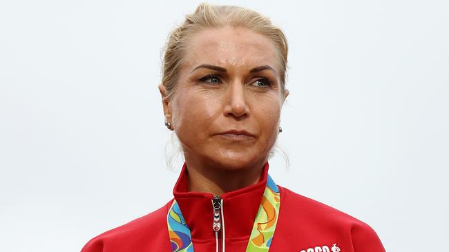 Silver medallist Olga Zabelinskaya of Russia stands on the podium at the medal ceremony for the Cycling Road Women's Individual Time Trial.