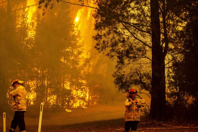 RFS firefighters desperately worked to save a home on Willinga Drive at Bawley Point, on the NSW south coast. Picture: Gary Ramage