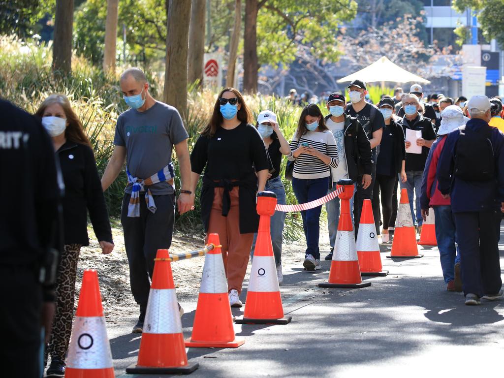 People queueing to receive their vaccination at the mass vax hub at Sydney Olympic Park. Picture: NCA NewsWire / Christian Gilles