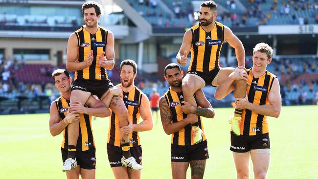 Paul Puopolo (top right) is chaired off in his last Hawthorn game. Picture: Mark Brake