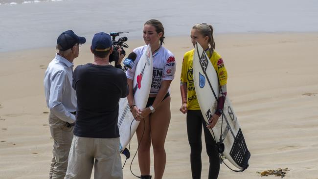 Carly Shanahan and Rosie Smart are interviewed at the at the inaugural Coffs Harbour Open at Diggers Beach. Photo: Ethan Smith / Surfing NSW