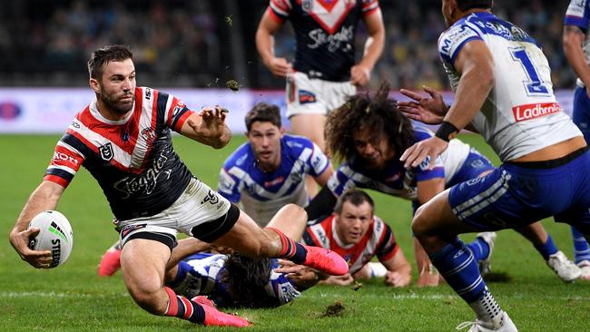 Roosters fullback James Tedesco skittles the Bulldogs defence at Bankwest Stadium on Monday night. Picture: AAP