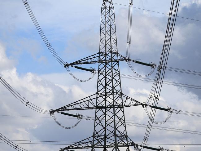 Electricity pylons hold power cables leading away from the SSE (Scottish and Southern Energy) gas-fired Keadby Power Station near Scunthorpe in northern England on September 6, 2022. - New UK Prime Minister Liz Truss inherits an economy set to enter recession before the end of the year, with double-digit inflation forecast to soar further. British households are facing an eye-watering 80-percent average hike in electricity and gas bills from next month, in a dramatic worsening of the cost-of-living crisis before winter. (Photo by Lindsey Parnaby / AFP)