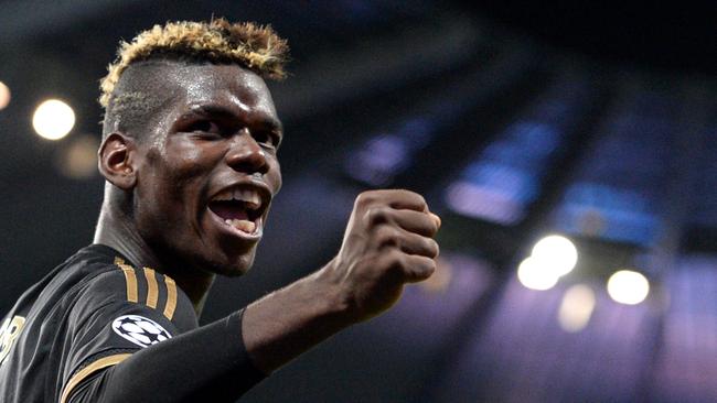 (FILES) This file photo taken on September 15, 2015 shows Juventus' midfielder from France Paul Pogba celebrating a goal during a UEFA Champions League group stage football match between Manchester City and Juventus at the Etihad stadium in Manchester, north-west England. French superstar Paul Pogba on August 9, 2016 completed a sensational return to Manchester United from Juventus for a reported world record fee. United said Pogba had signed a five-year contract but did not give the cost which British media have put at 89 million pounds ($116.4 million, 105 million euros), not including agent's fee. / AFP PHOTO / OLI SCARFF