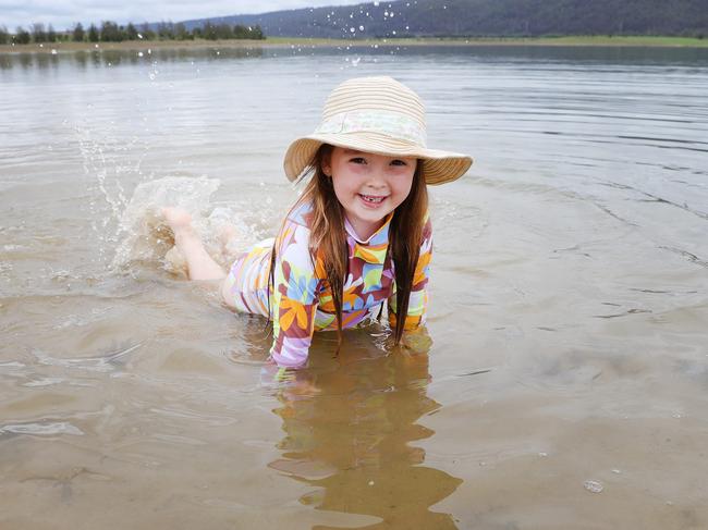 Violet Tickner, 5, makes a splash at a new swimming beach in Penrith. Picture: Rohan Kelly