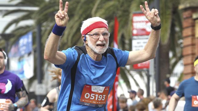 CITY to BAY - FINISH LINE. John,72, (no last name given) of Colonel Light Gardens crosses the finish line.15 September 2019. (AAP Image/Dean Martin)