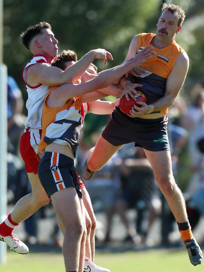 Giants forward Josh Webster drags in a chest mark.