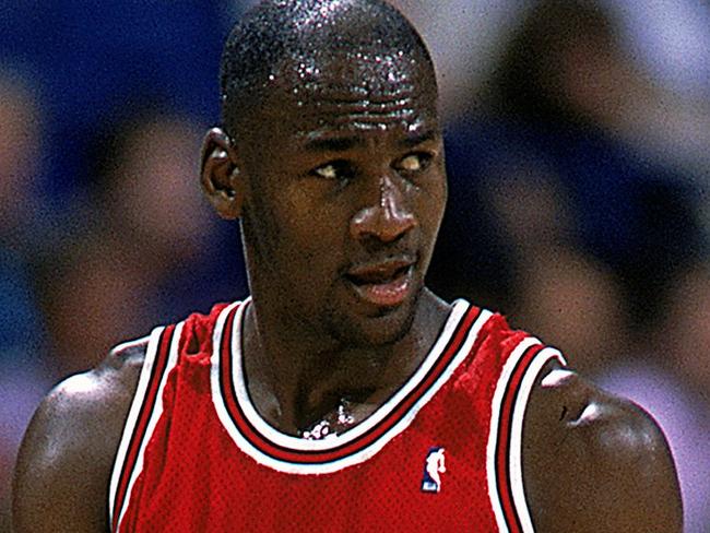 1989:  Michael Jordan #23 of the Chicago Bulls walks and looks on from the court during the game.   Mandatory Credit: Joe Patronite  /Allsport