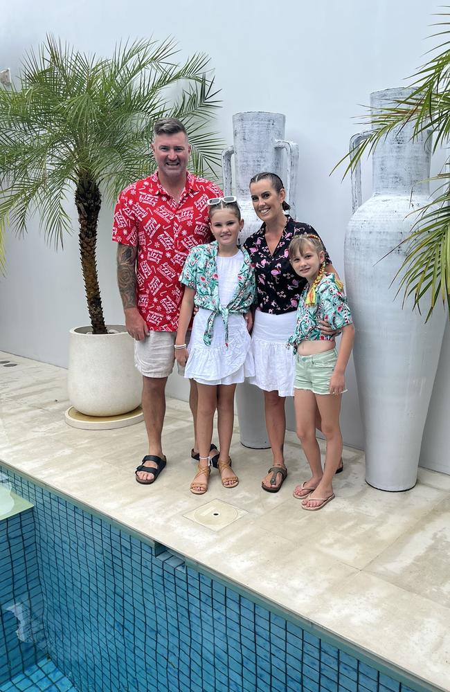 Sarah Neal with her husband David, 39, and their two daughters aged 12 and nine, in Bali.